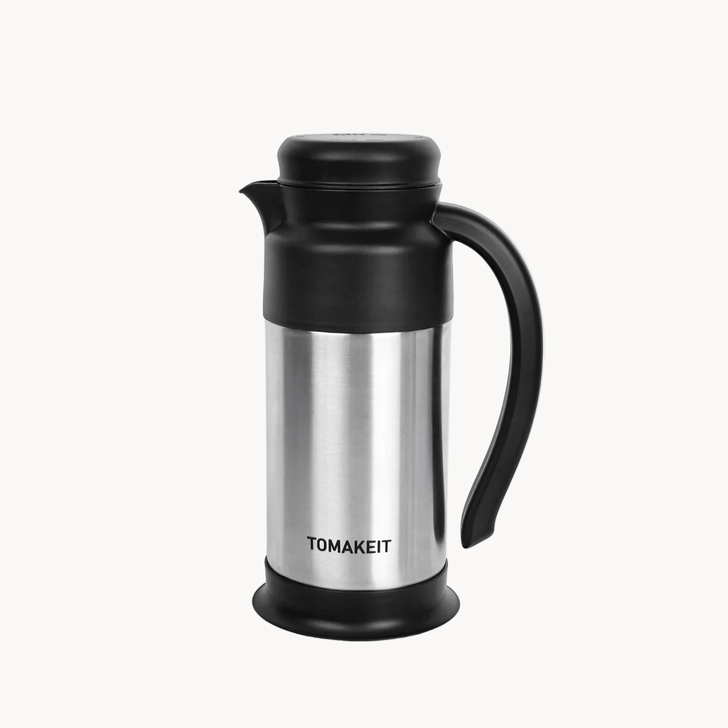 Stainless steel and black thermos carafe with 'TOMAKEIT' branding on a white background